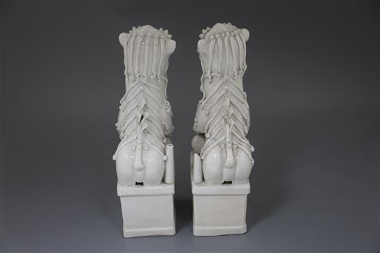 A pair of large Chinese blanc de chine Buddhist Lion joss stick holders, Dehua, Kangxi period, H. 34.5cm